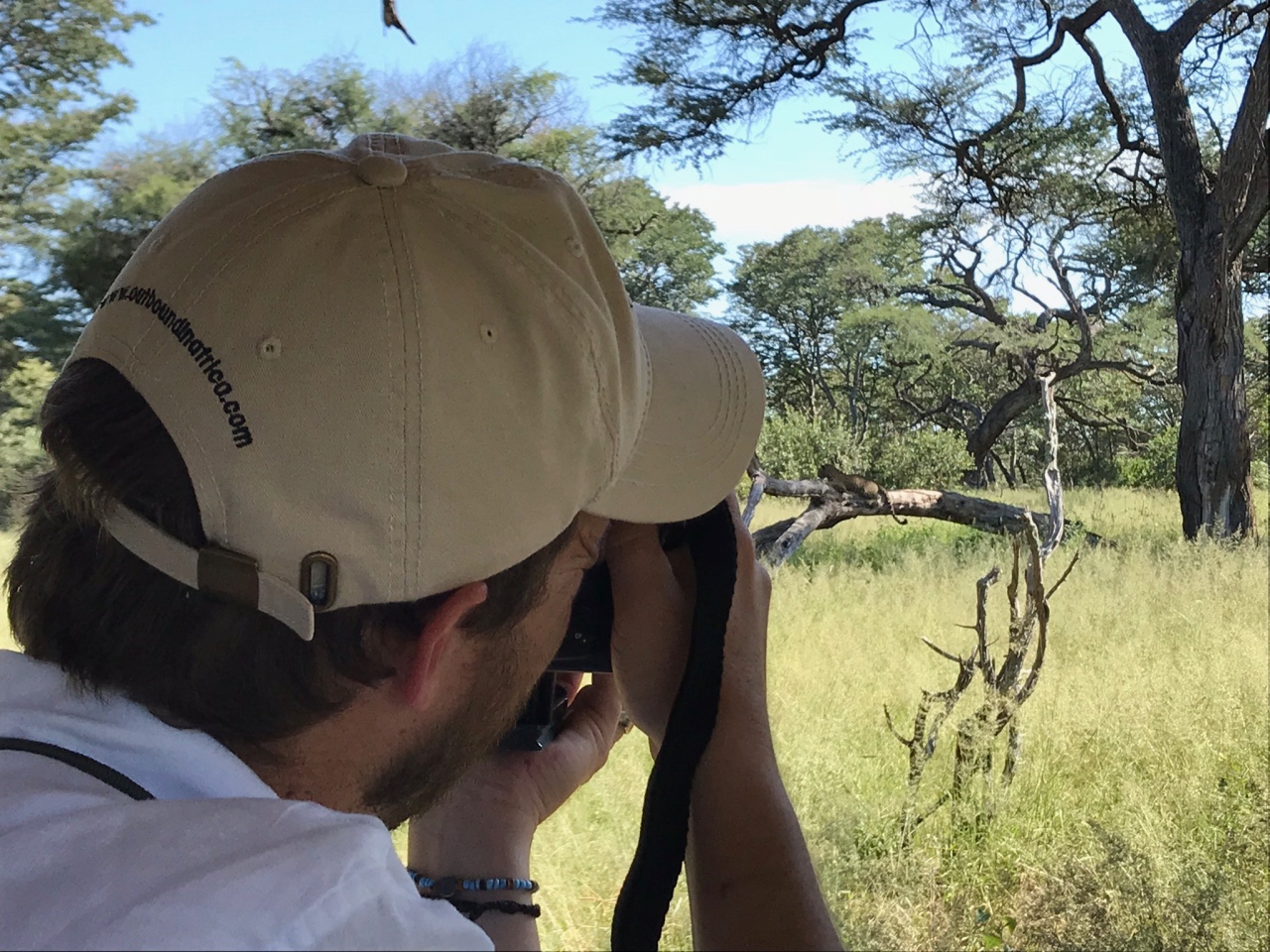 Marnus photographing a perfectly posing leopard in Hwange National Park